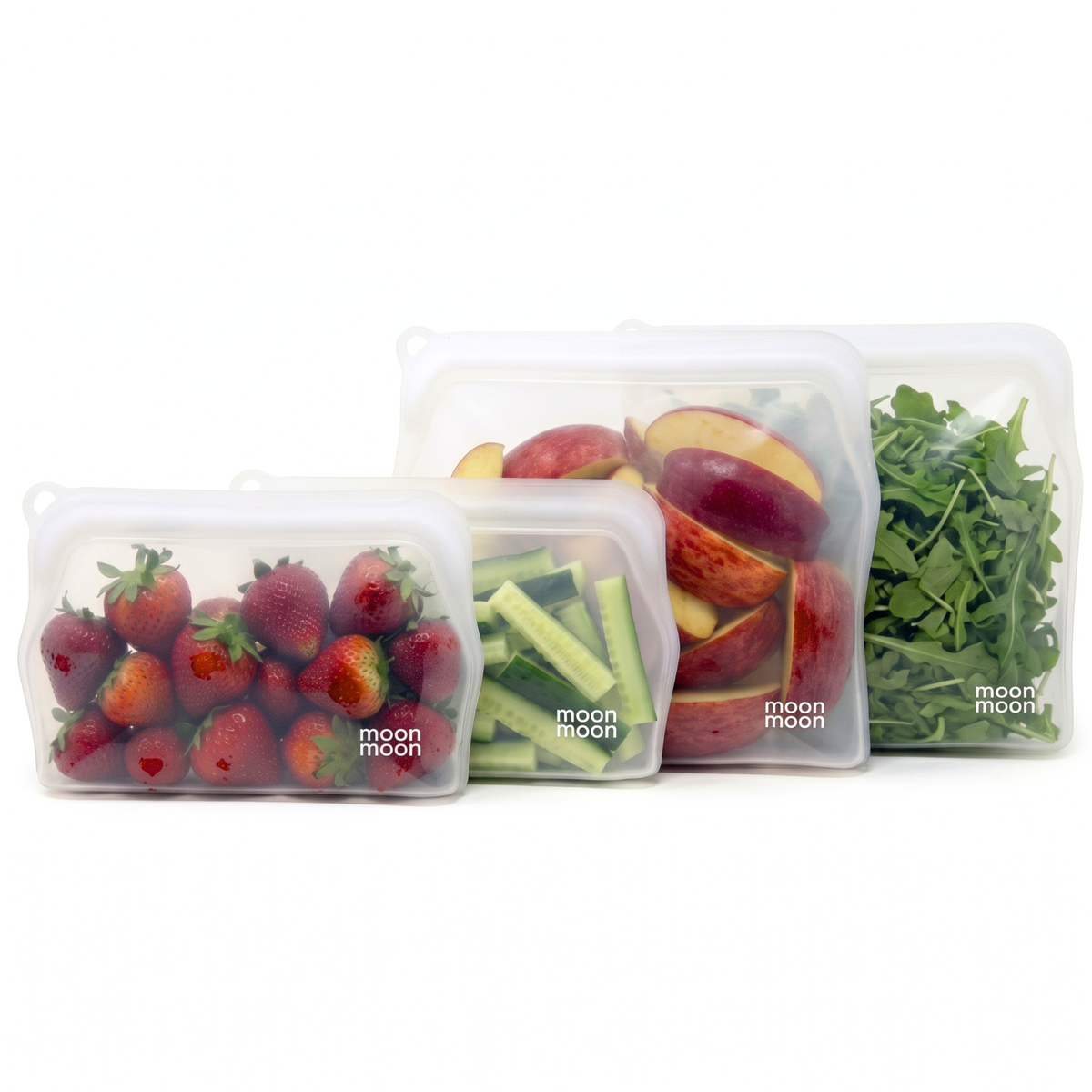 Set of four clear slim silicone food pouches in 330ml and 900ml sizes filled with fruits and vegetables