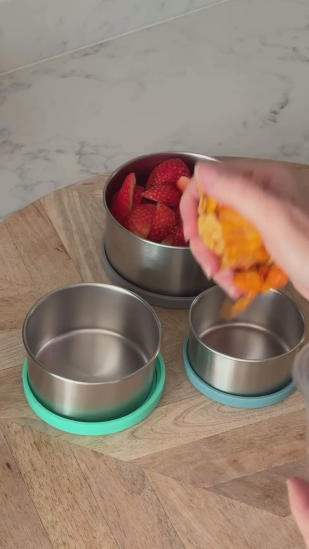 Moonmoon Stainless steel lunch box and snack pots being used for children's plastic-free packed lunch 